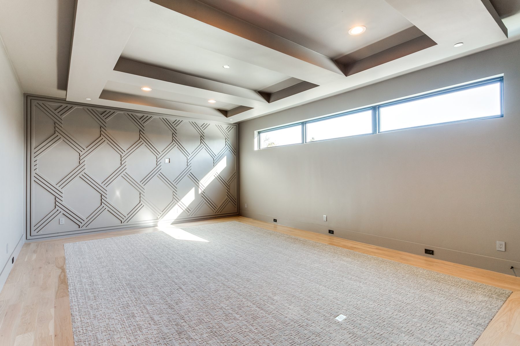 Upstairs lounge with geometric millwork wall